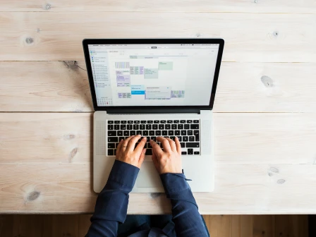 Woman using google sheets plugin for address validation
