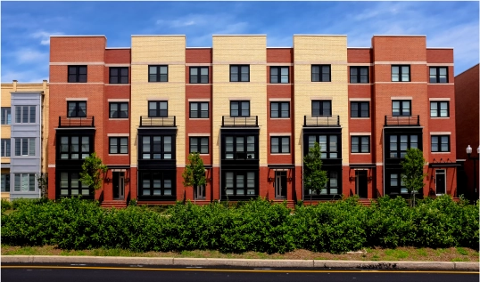 5 town homes stacked side-by-side, each 4 stories tall. All orange and yellow colors.