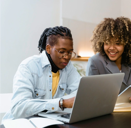 people looking at laptop computer